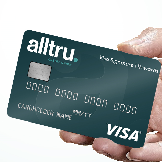 Hand holding an Alltru Signature Rewards Credit Card