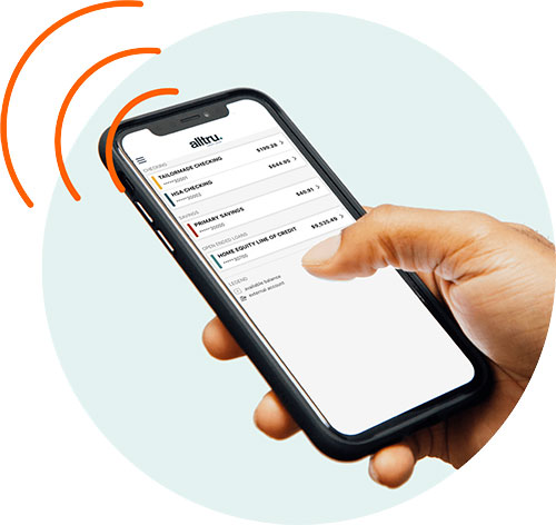 A hand holding an iPhone on the Alltru CU mobile app. Image is inside of a circle shape.