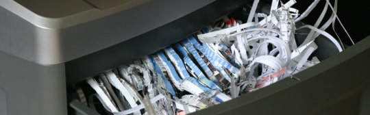 Papers being shredded during Shred Day event