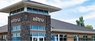 Tan and brick Alltru Credit Union branch located in St. Charles, Missouri.
