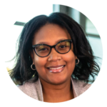 Alltru member Brianna, a middle-aged African-American woman with shoulder length straight hair and glasses