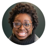 Alltru member Meaghan, a young African-American woman with short, curly hair and glasses