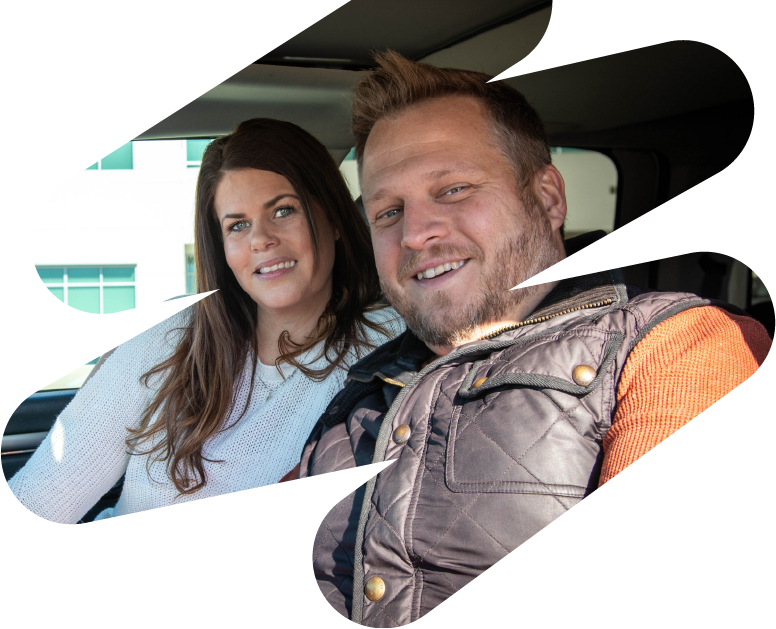 Couple Bex and Chris pictured sitting inside of their car outside of the Alltru Branch located in Wentzville.
