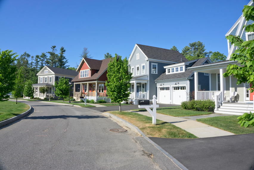 A street view of several new homes on the right.