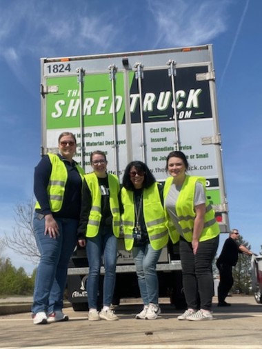 A group of Alltru employees behind The Shred Truck