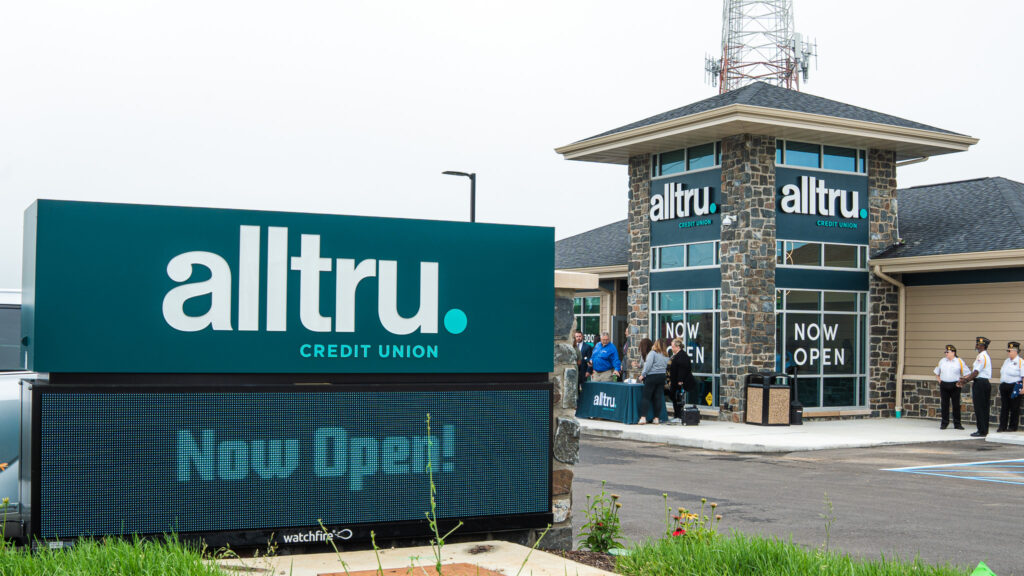 A photo of Alltru's now open sign by the street in front of the Florissant branch