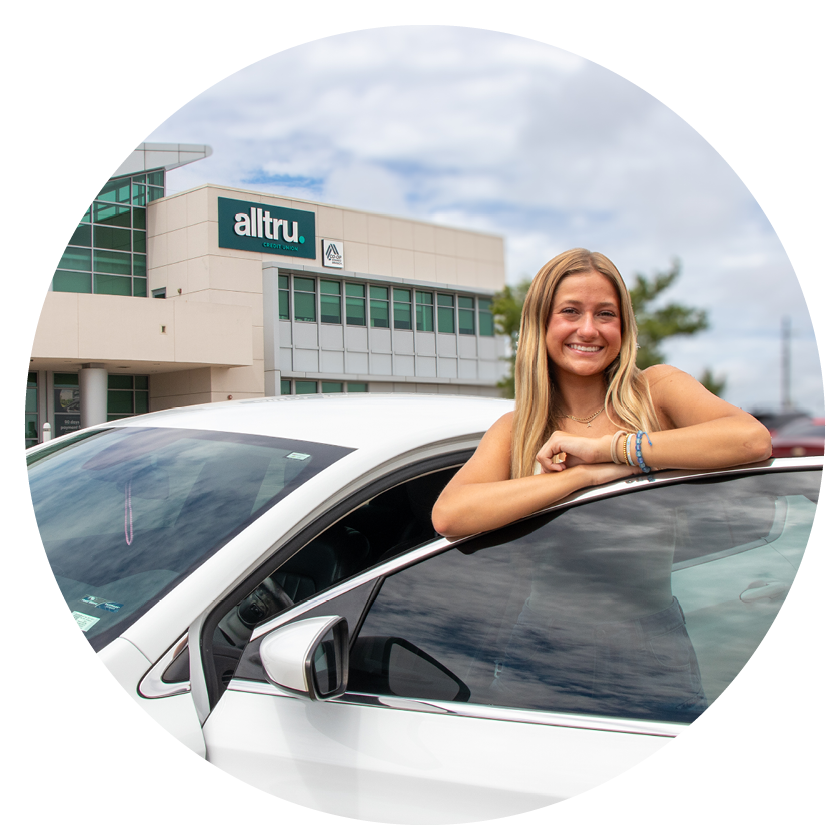 Auto Loans | Alltru Credit Union | St. Louis, MO Alltru member Alexa standing outside her car outside the Wentzville branch. Image is in a circle shape