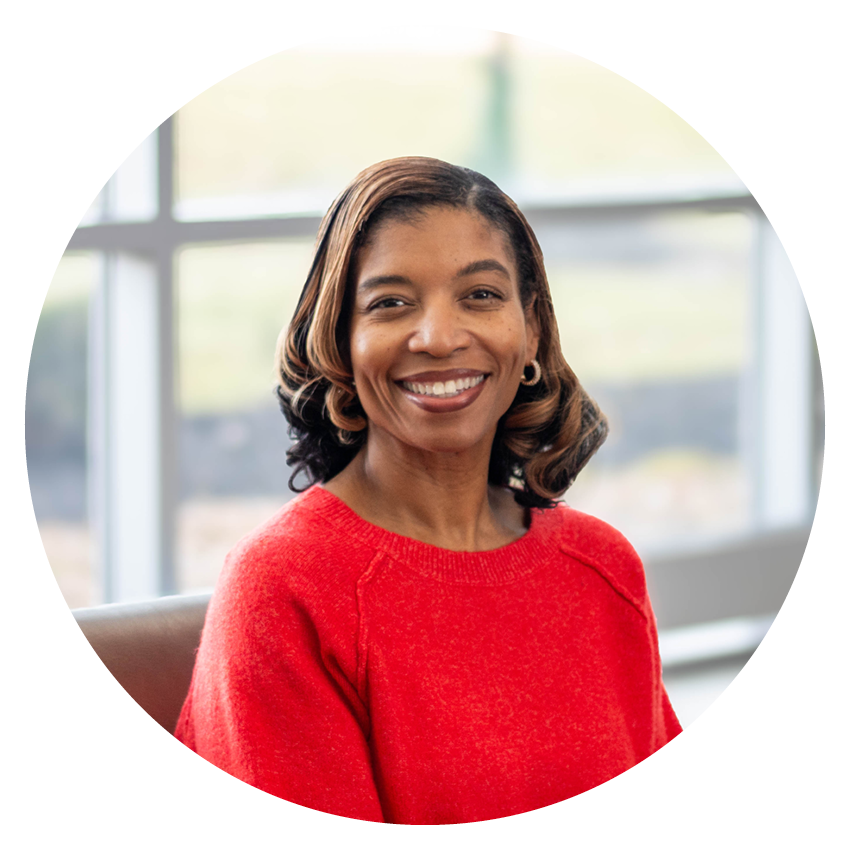 Alltru member Danielle wearing a red sweater in the Wentzville branch